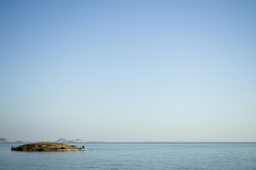 a small island in the middle of a large body of water