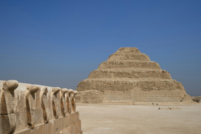 a very tall pyramid sitting in the middle of a desert