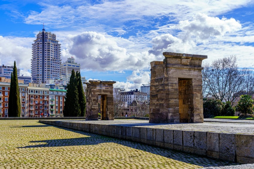 city skyline under blue and white sunny cloudy sky during daytime mFgHoAY