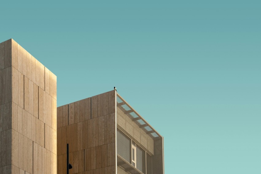 brown high rise building under clear sky during daytime