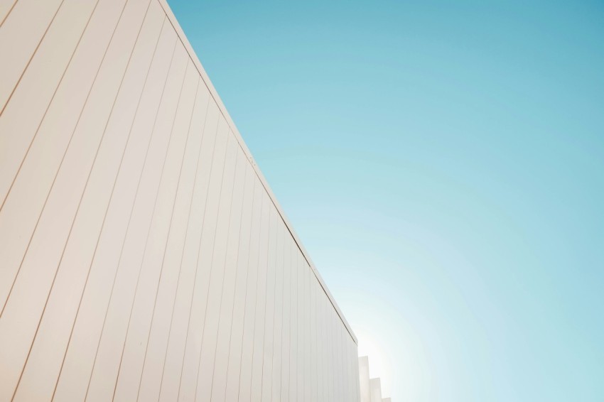 low angle photography of building under clear blue sky