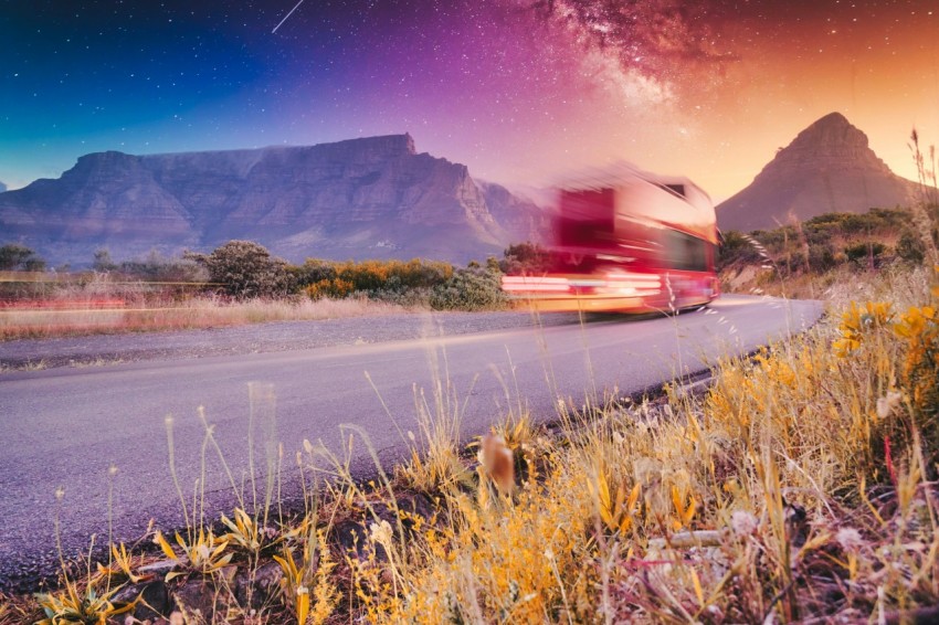 red car on road during night time