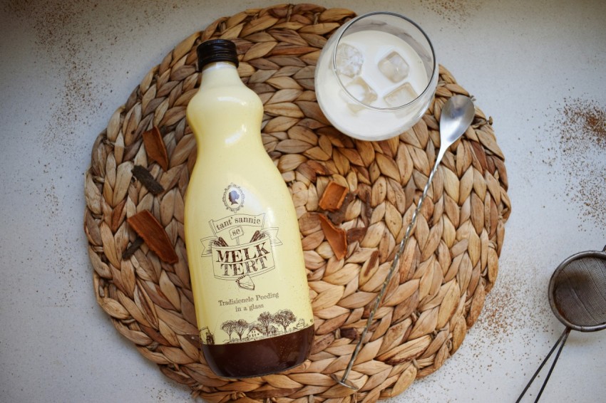 a bottle of milk sitting on top of a basket