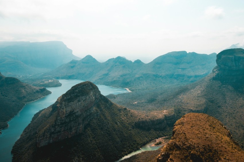 a view of a mountain range with a body of water in the distance