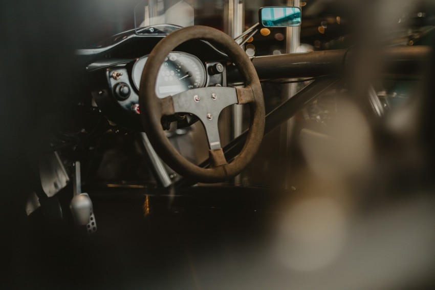 black steering wheel in close up photography