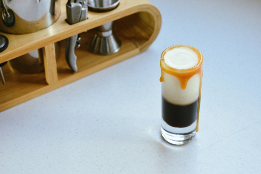 a cup of coffee sitting on top of a counter