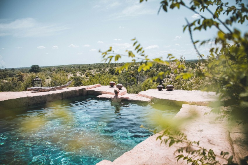 man and woman in swimming pool during daytime