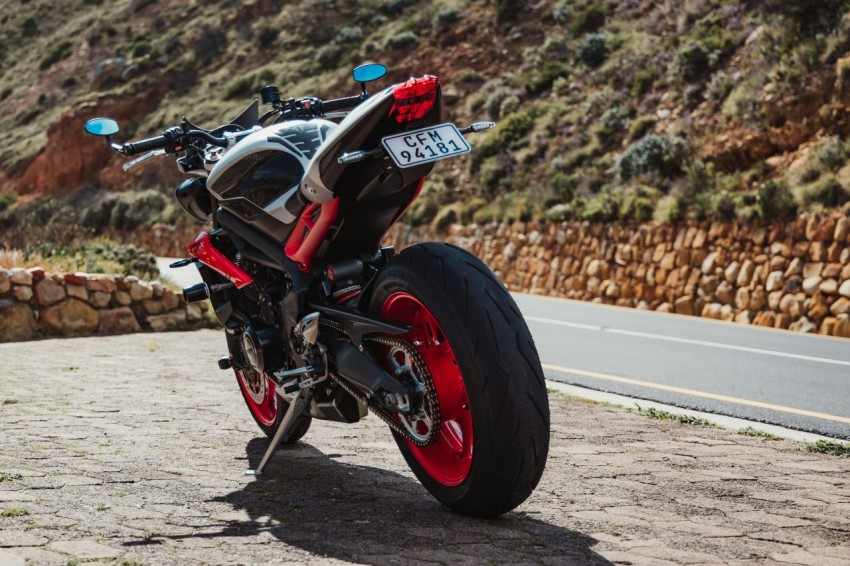 a motorcycle parked on the side of a road