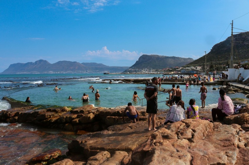 a group of people at a beach hl