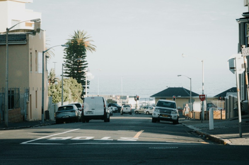 a street filled with lots of traffic next to tall buildings