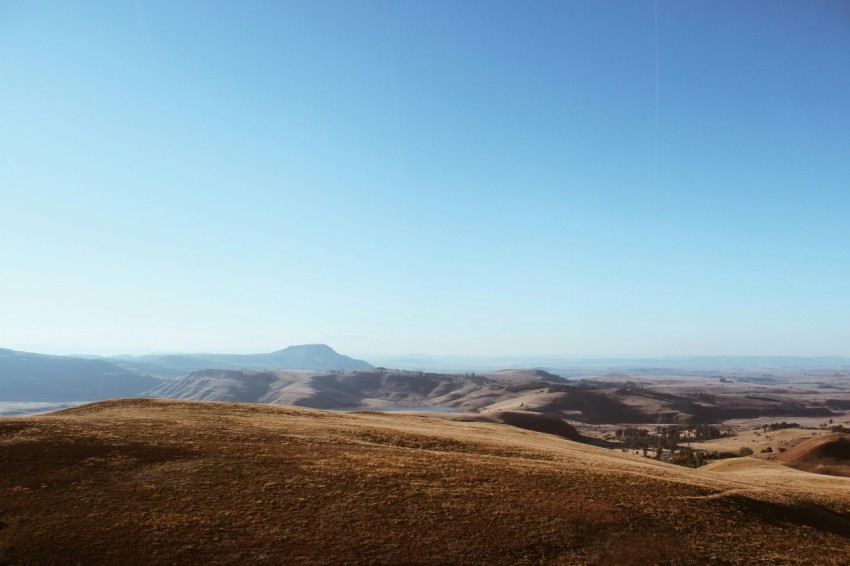 a view of a mountain range with hills in the distance h9C