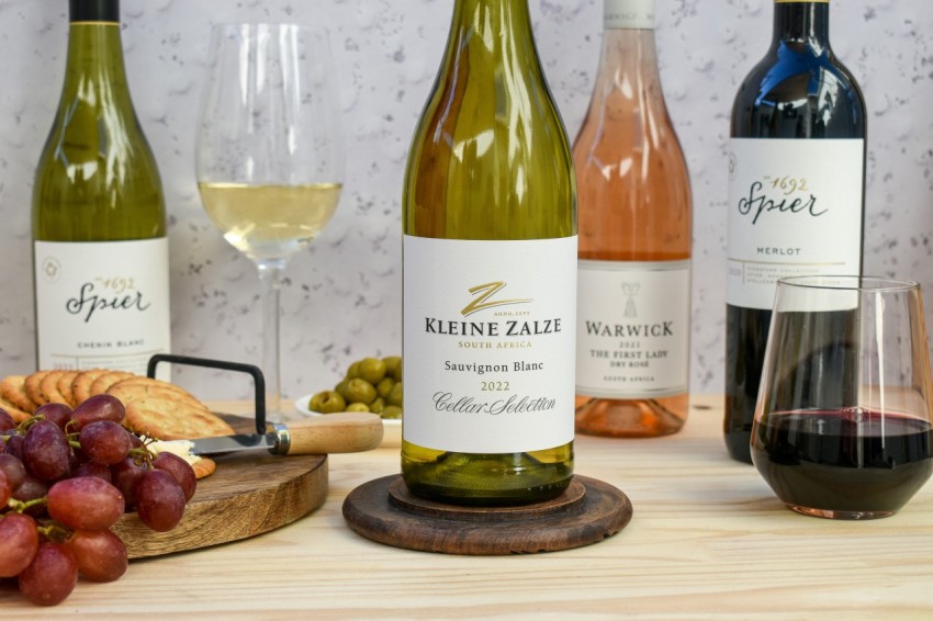 a bunch of bottles of wine sitting on a table