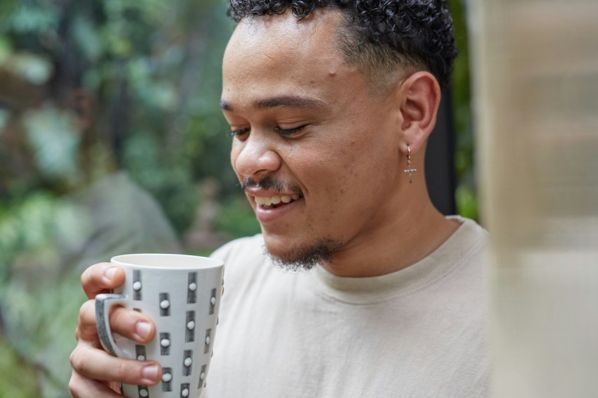 a person holding a cup