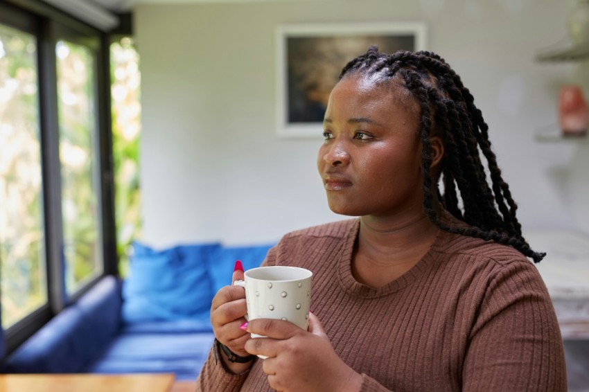 a person holding a cup