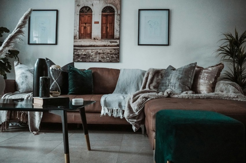 black leather bag on red sofa