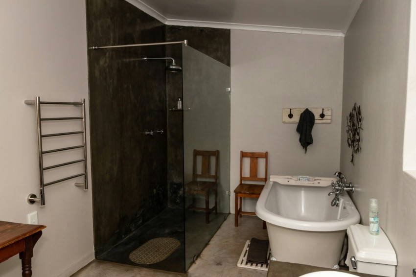 a bathroom with a tub and sink OZW