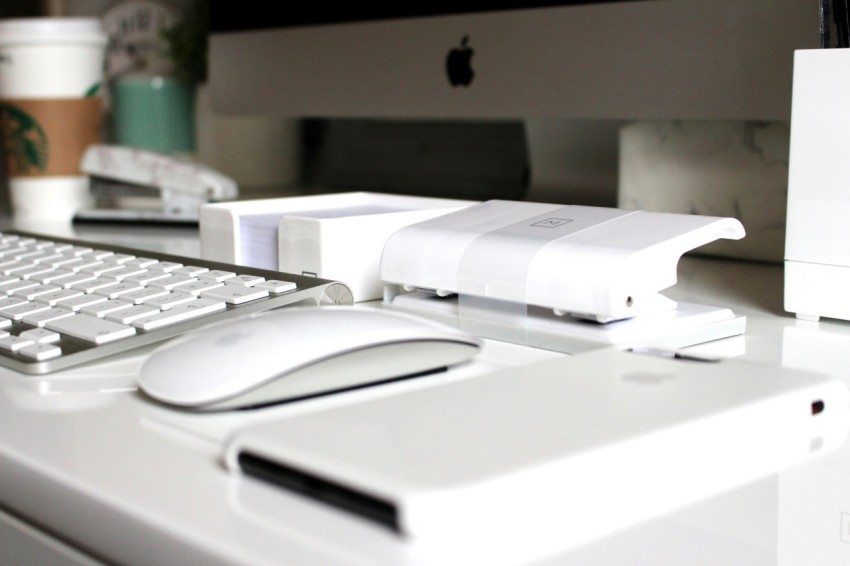 apple magic mouse on white table