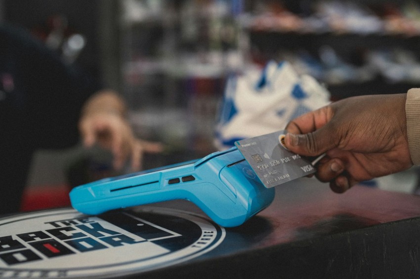 a person holding a blue object in their hand