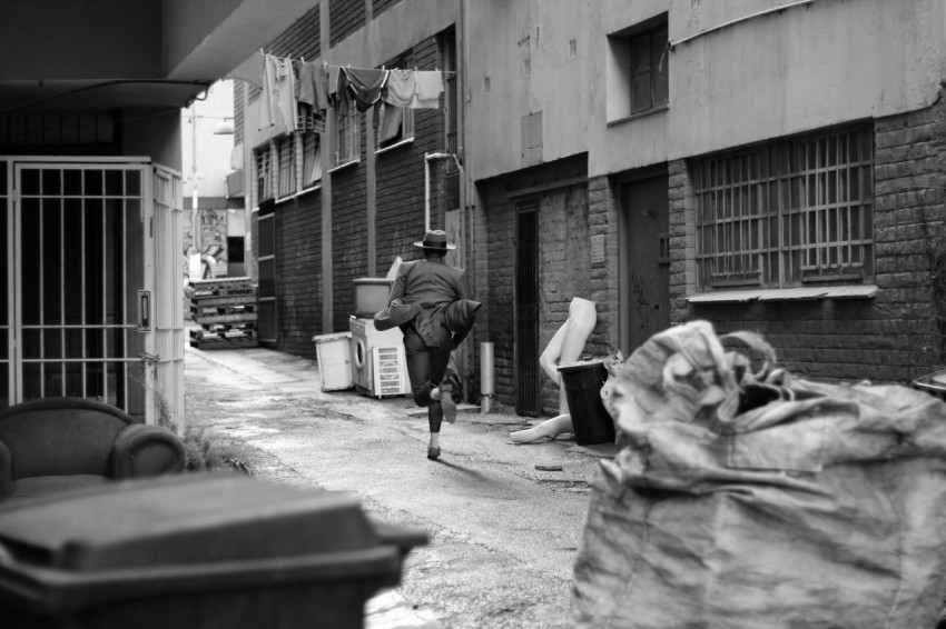 person running along alley