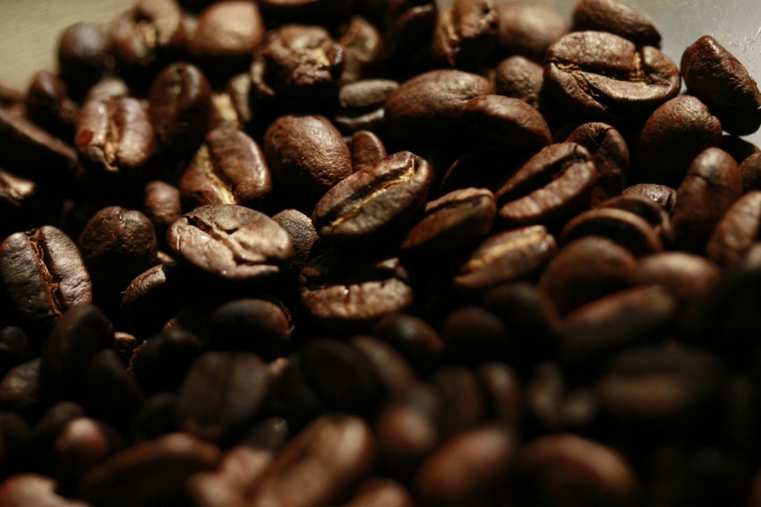 a pile of coffee beans sitting on top of a table