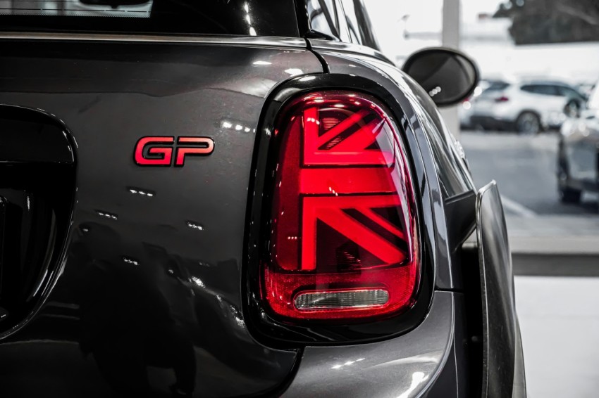 black and red car in grayscale photography