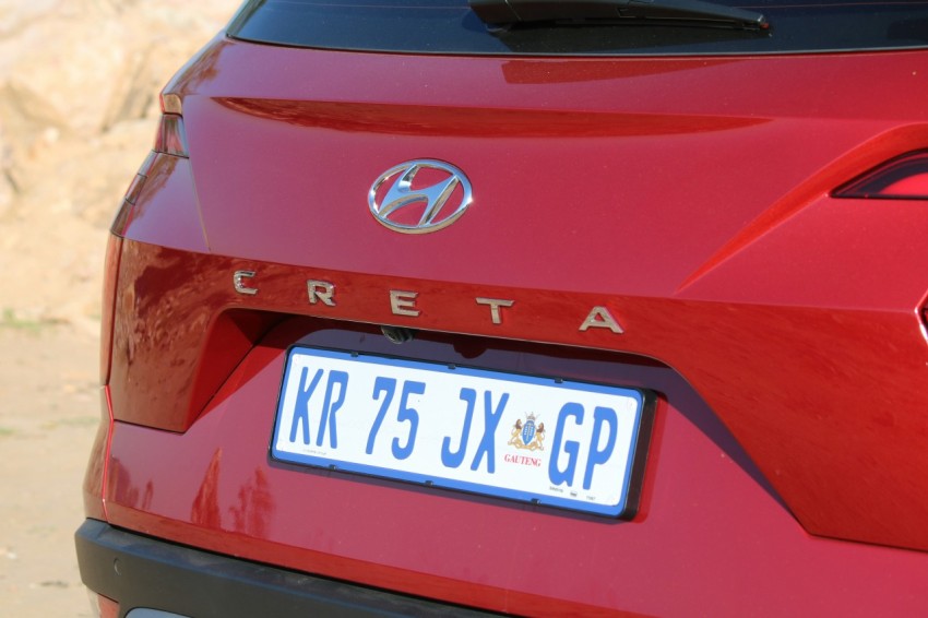 a close up of a red car with a license plate