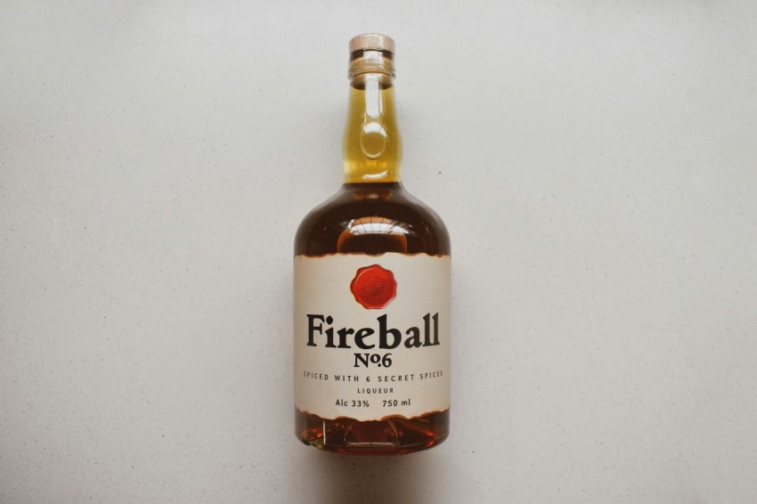 a bottle of fireball no 6 sits on a table