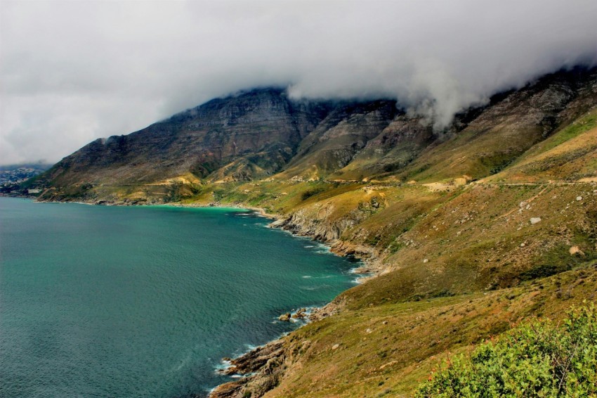 landscape photography of body of water near mountain