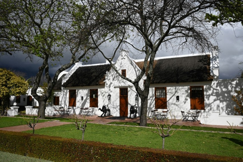 a white house with a lawn in front of it