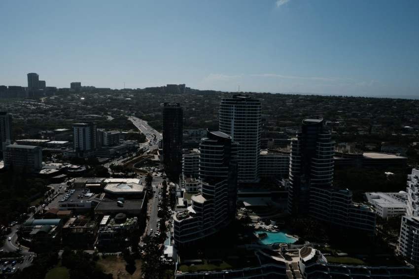 an aerial view of a city with tall buildings