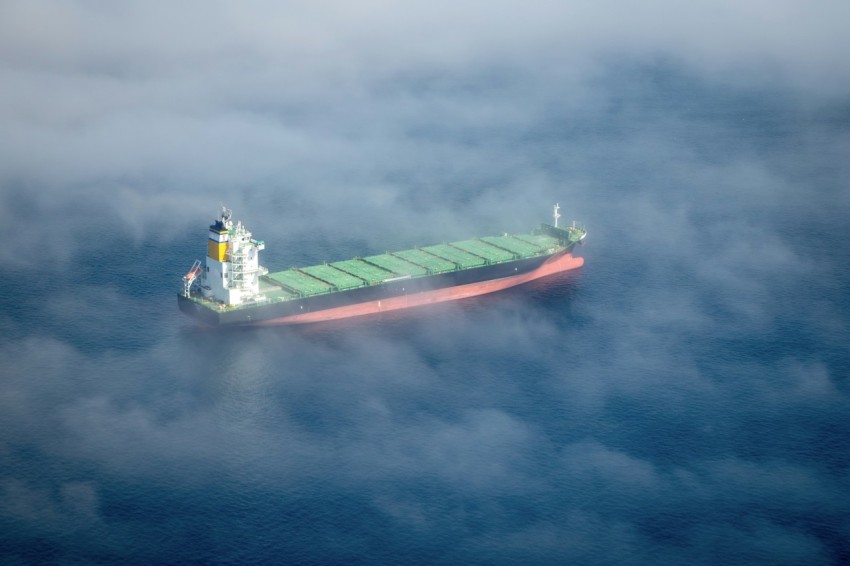 a large cargo ship in the middle of the ocean VEm9T