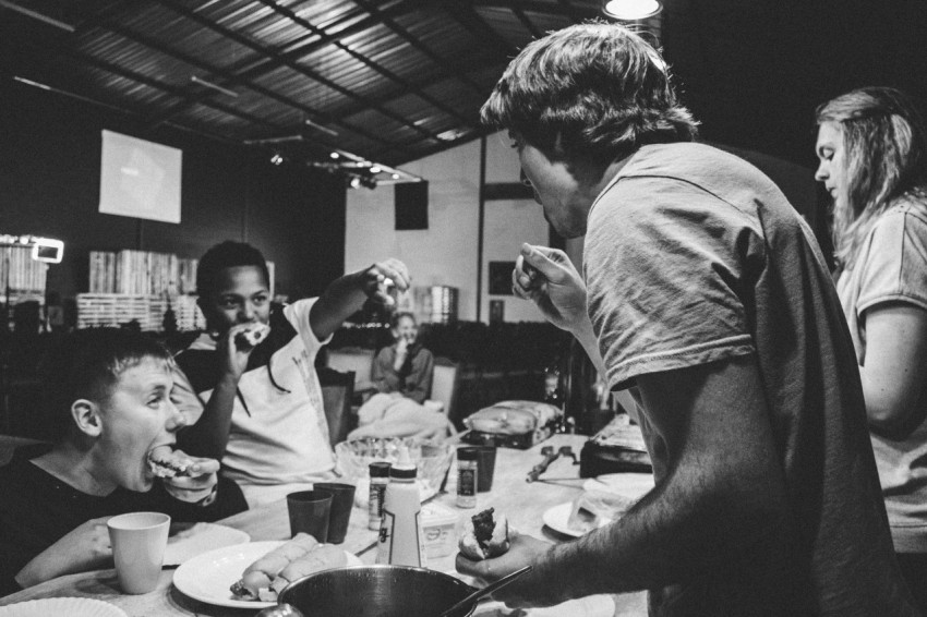 grayscale photography of people eating food aGZeHyx