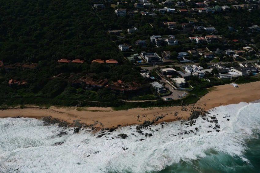 a birds eye view of a beach and ocean