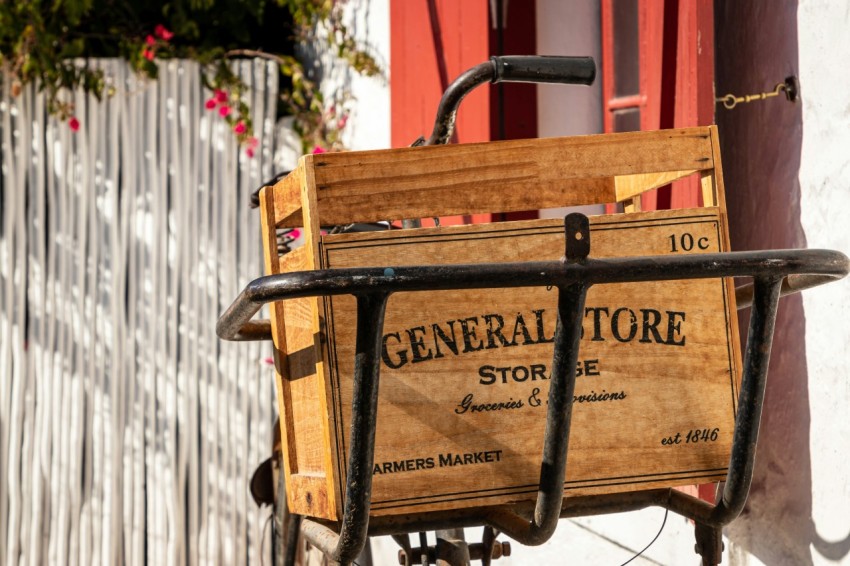 a wooden crate sitting on the side of a building