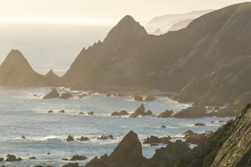 a large body of water surrounded by mountains Bo