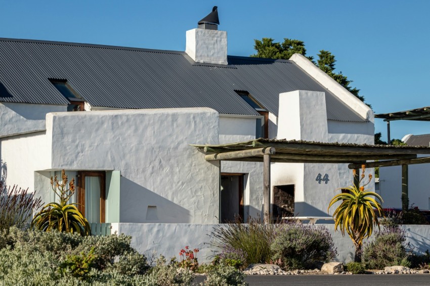 a large white house with a black roof