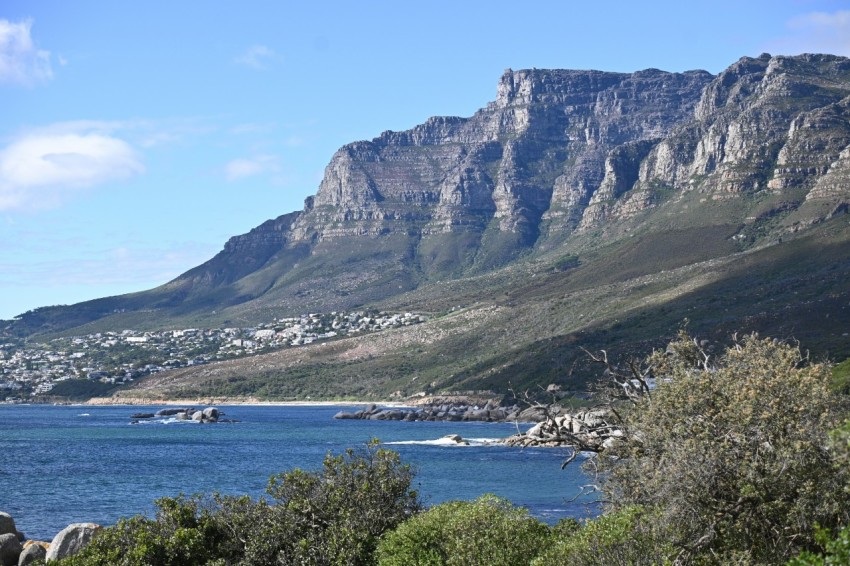 a mountain with a body of water in front of it