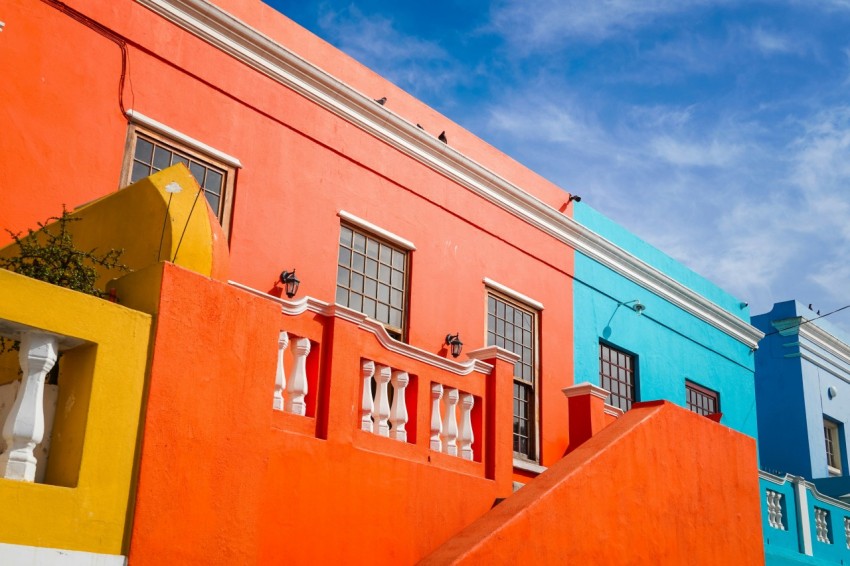 orange and white concrete building under blue sky during daytime