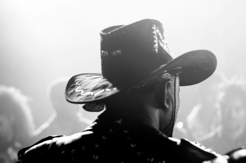 person wearing black cowboy hat