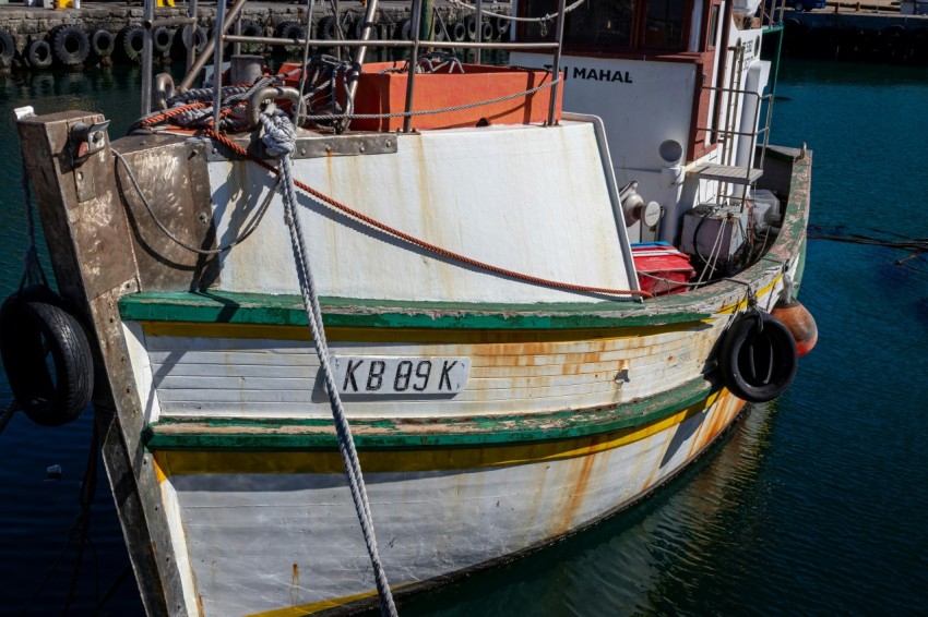 a boat docked at a dock in the water