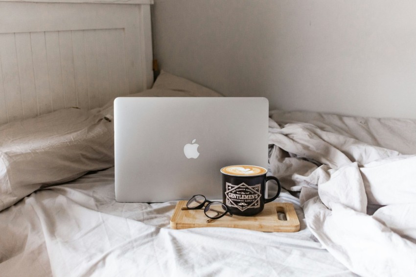 macbook air on brown wooden table