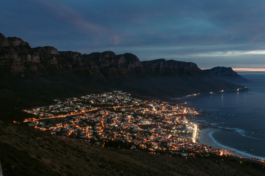 city near mountain during night time W8Ja