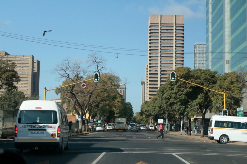 a busy street with cars and buses