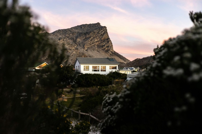 a house in the middle of a mountain range