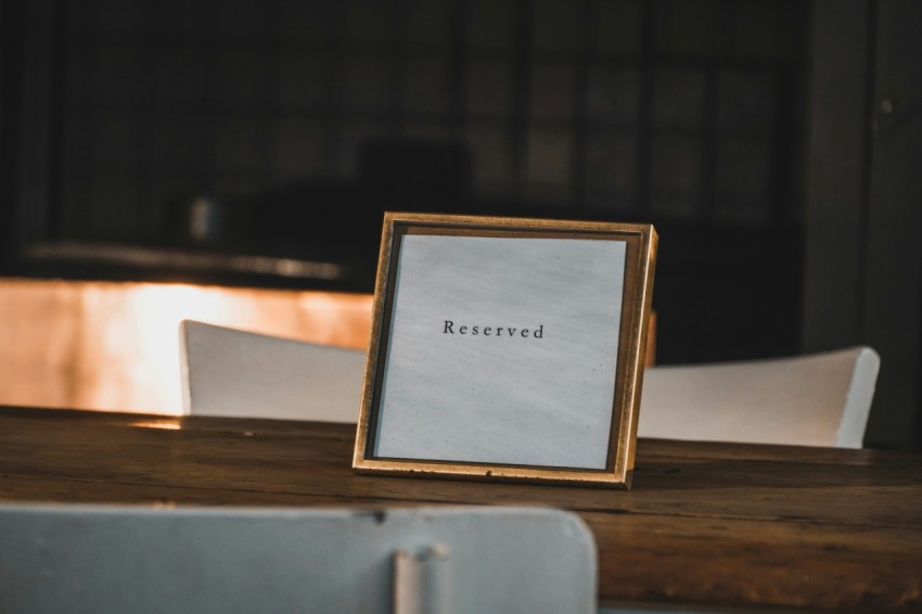 a picture frame sitting on top of a wooden table