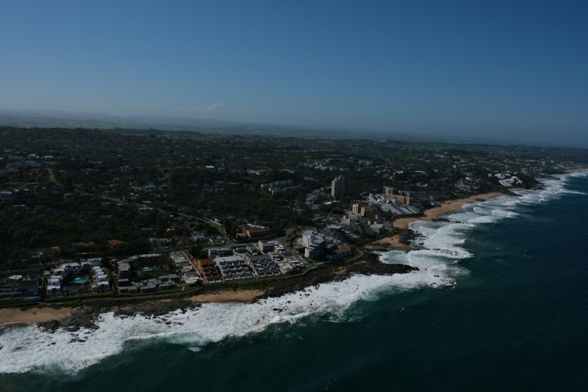 a birds eye view of a beach and ocean