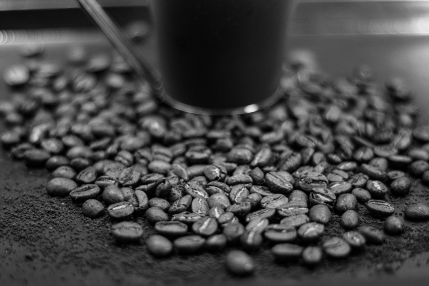 black ceramic mug on black and white textile j