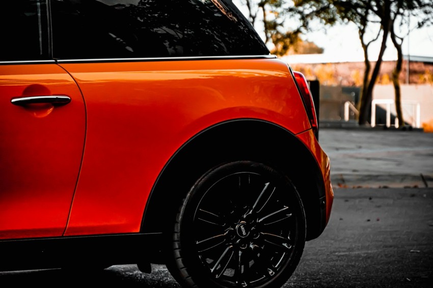 orange car on road during daytime