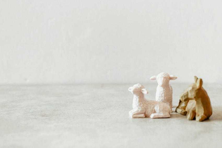 a couple of figurines sitting on top of a table