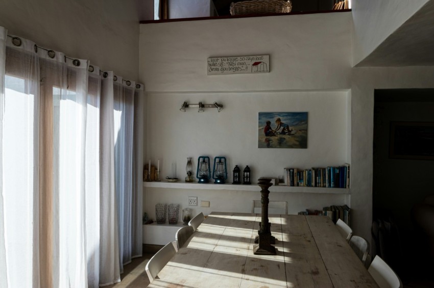 a dining room with a table and chairs in it